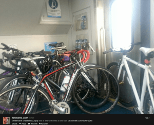 Crowded train car designed to accommodate only three bicycles.